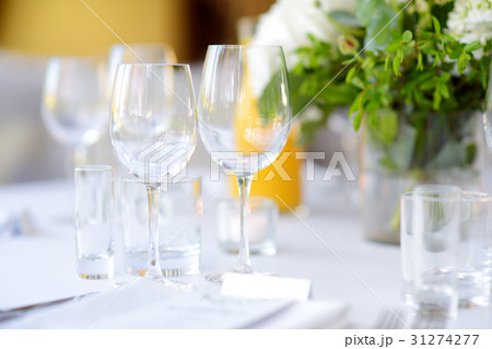 Beautiful table setting with crockery and flowers 31274277