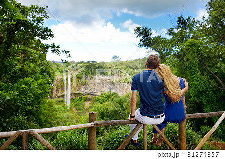 Young couple enjoying a view on Chamarel falls Young couple enjoying a view on Chamarel falls 31274357