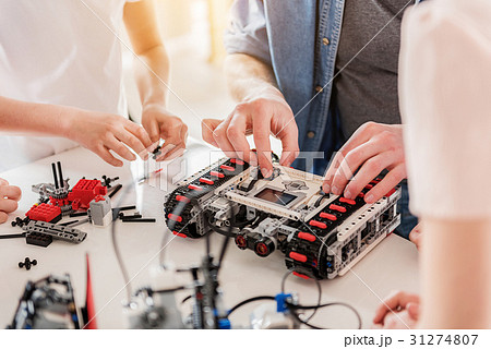 Busy technical team working on toy 31274807