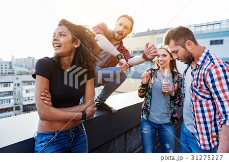 Excited friends having fun on roof Excited friends having fun on roof 31275227