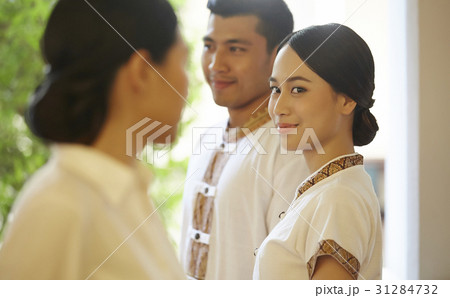 A photo of staff smiling in the hotel. 31284732