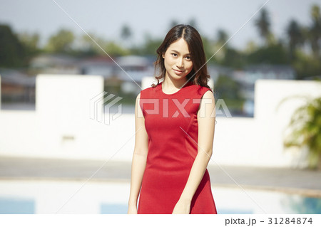 The girl is very attractive with a red dress 31284874