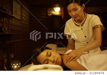 young woman getting massage in asian spa 31284976