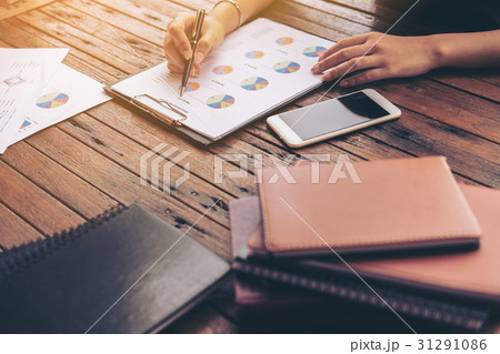 Businesswoman checking a business report Businesswoman checking a business report 31291086