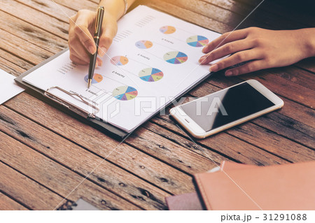 Businesswoman checking a business report Businesswoman checking a business report 31291088