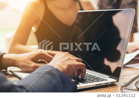 Businessman using laptop in Business meeting Businessman using laptop in Business meeting 31291112