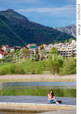 woman with smartphone backpacking in mountains 31291214
