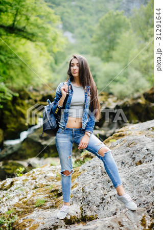 woman with backpack travel mountain river woman with backpack travel mountain river 31291644