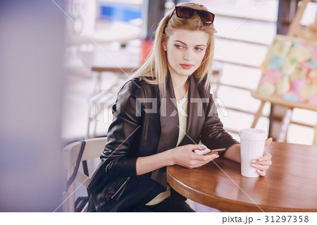 beautiful blonde in  cafe 31297358