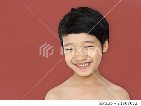 Smiling asian ethnicity boy in a shoot Smiling asian ethnicity boy in a shoot 31307052