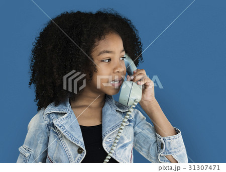 Little Girl Talking on the Phone Communication Studio Portrait Little Girl Talking on the Phone Communication Studio Portrait 31307471