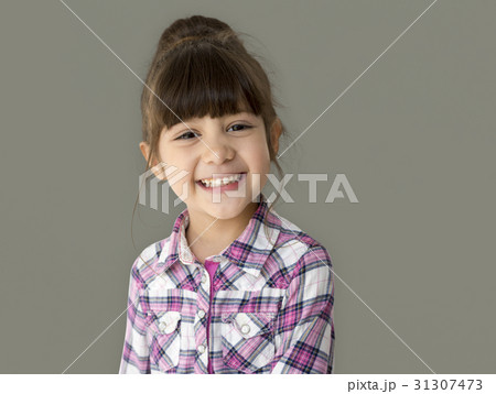 A little girl with a cheerful smile 31307473