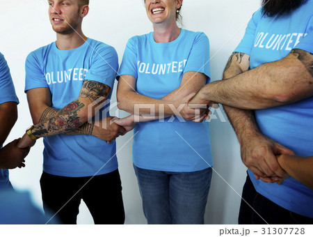 Group of volunteer people smiling and holding hand together Group of volunteer people smiling and holding hand together 31307728