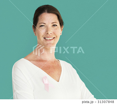 Woman with pink ribbon for breast cancer awareness charity studio portrait 31307848