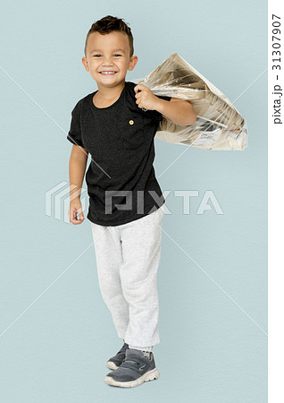 Little Boy Holding Separate Papers Studio Portrait Little Boy Holding Separate Papers Studio Portrait 31307907