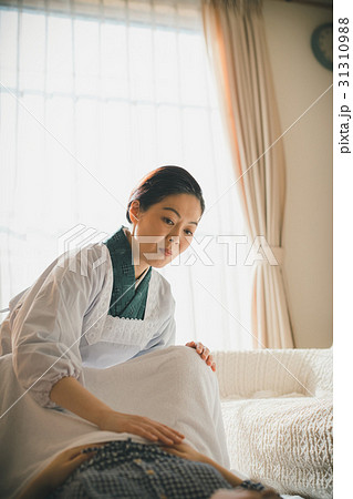 woman during pregnancy or shortly after childbirth 31310988