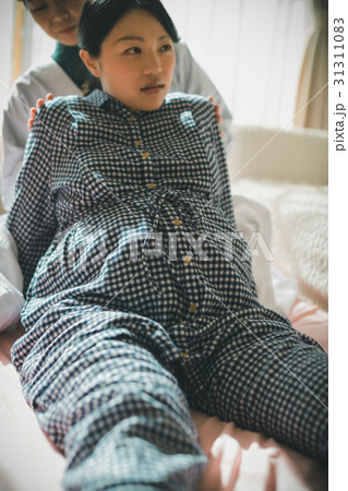 woman during pregnancy or shortly after childbirth 31311083