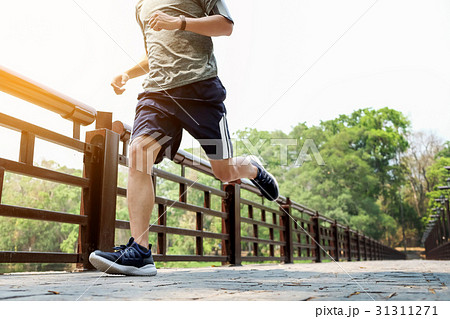 Male runner at sprinting speed training  31311271