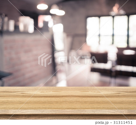 wood table and blurred cafe light background 31311451