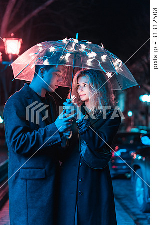 Portrait of a guy and a girl under an umbrella 31312508