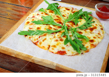 Pizza on wooden tray 31315485