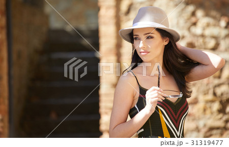 Fashionably dressed woman on the streets of a small Italian town Fashionably dressed woman on the streets of a small Italian town 31319477