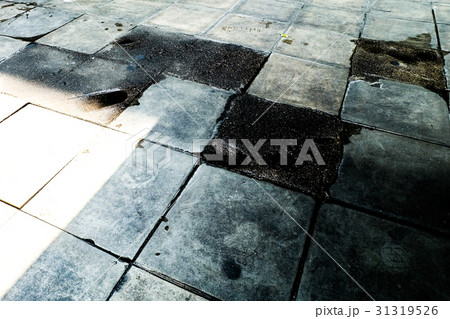 The footpath is Damaged out of care in the city The footpath is Damaged out of care in the city 31319526