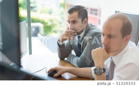 Business team analyzing data at business meeting. Business team analyzing data at business meeting. 31320333