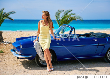 Woman near retro cabriolet car  31321161