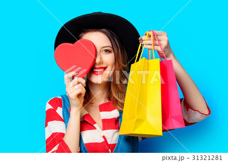 woman with heart shape toy and shopping bags 31321281