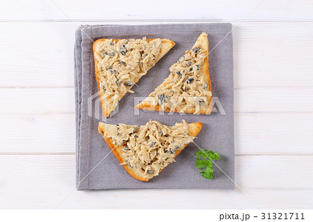 toast with grated cheese and olive spread 31321711