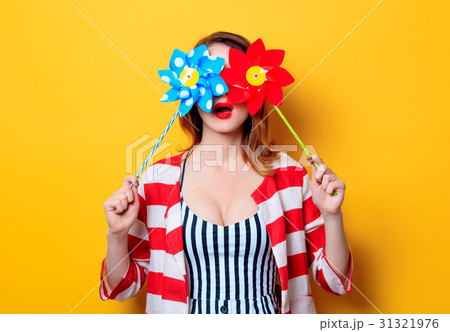 Woman with pinwheel toy Woman with pinwheel toy 31321976