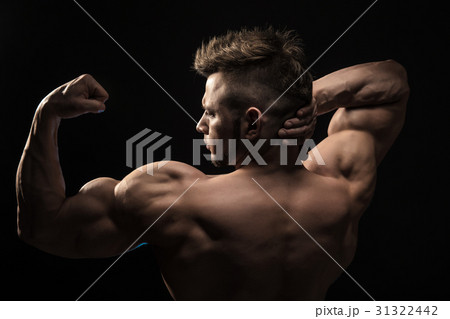Strong Athletic Man Fitness Model posing back 31322442