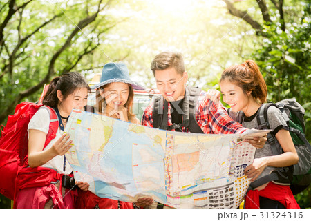 Hiking - hikers looking at map. 31324316