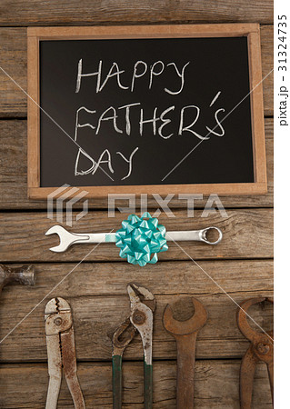 Slate with happy fathers day text and hand tools Slate with happy fathers day text and hand tools 31324735