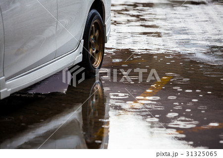 Car park with water on ground in raining day 31325065