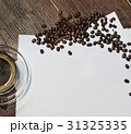 Coffee and coffee beans on wooden table and notes 31325335