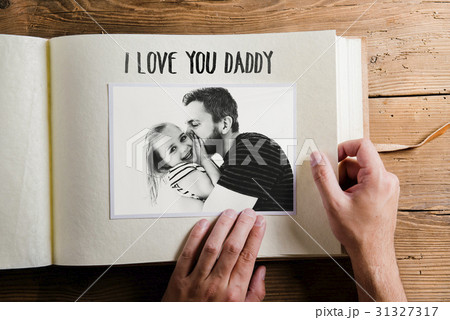 Fathers day concept. Photo album. Wooden Fathers day concept. Photo album. Wooden 31327317