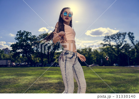 carefree girl with zizi cornrows dreadlocks 31330140