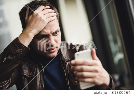 Bad news. Depressed young man expressing 31330564