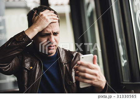 Bad news. Depressed young man expressing 31330565