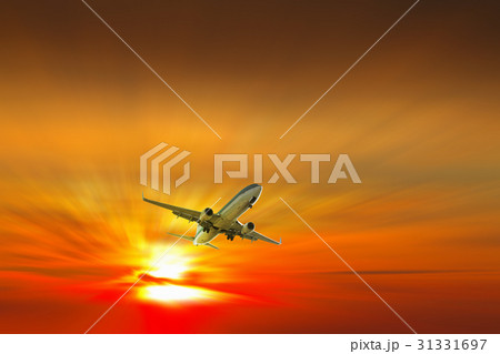 Airplane on sunrise background Airplane on sunrise background 31331697