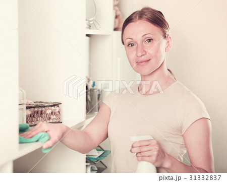 Woman cleaning furniture Woman cleaning furniture 31332837
