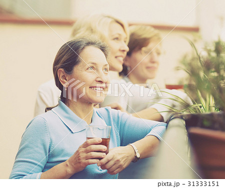mature woman on a balcony 31333151