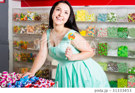 sexy young woman posing in the store with lolly 31333653