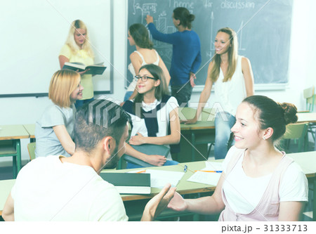 students chatting and smiling at the college 31333713
