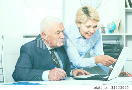 Aged manager working with secretary 31333965