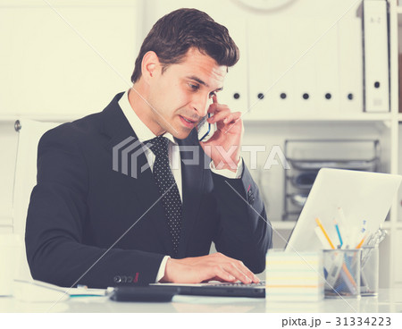 Businessman having phone call Businessman having phone call 31334223