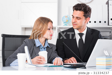 Business partners working in office 31334237