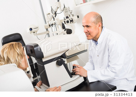 Checking eyesight in clinic. 31334413